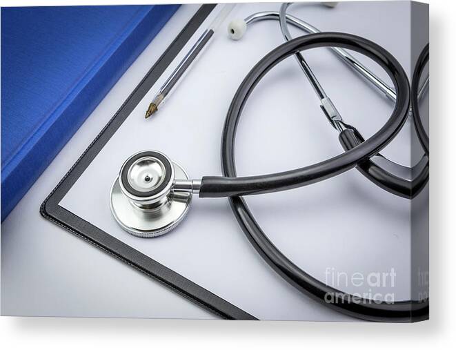 Book Canvas Print featuring the photograph Stethoscope Next To A Book #1 by Digicomphoto/science Photo Library