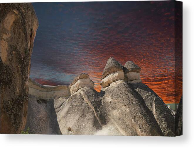 Volcanic Canvas Print featuring the photograph Sunset on fairy chimney balanced rock formations #1 by Steve Estvanik