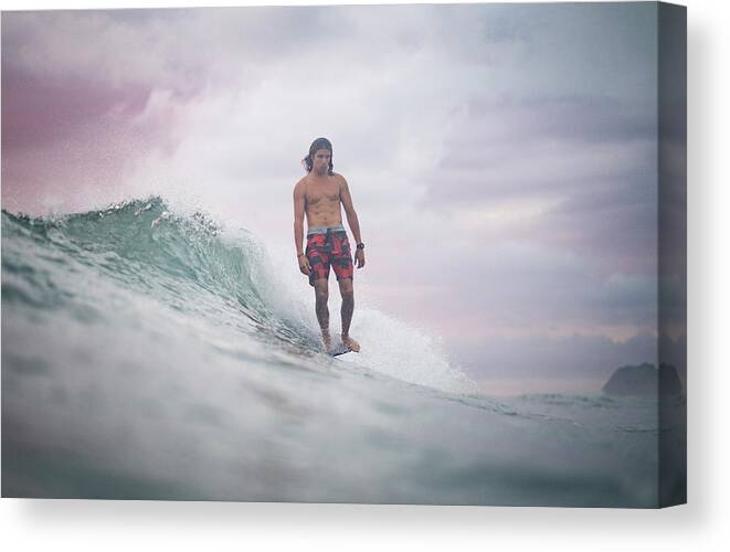 Surf Canvas Print featuring the photograph Surfing The Sunrise In Costa Rica #1 by Cavan Images