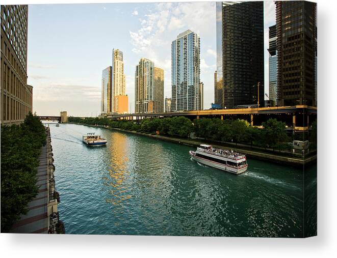 Chicago River Canvas Print featuring the photograph The Chicago River Runs In A Skyscrapers #1 by Maremagnum