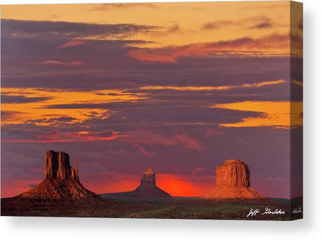 Arid Climate Canvas Print featuring the photograph The Mittens and Merrick Butte at Sunset by Jeff Goulden