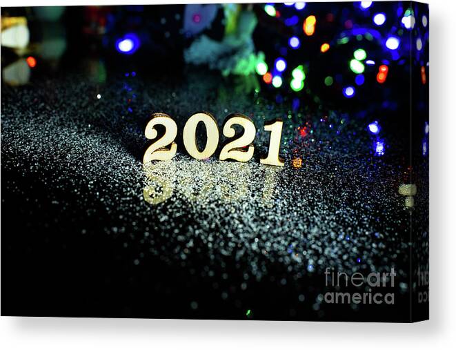 2021 Canvas Print featuring the photograph 2021 happy new year wood number Christmas decoration and snow with bright background and copy space by Joaquin Corbalan