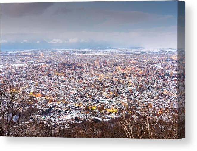 Landscape Canvas Print featuring the photograph Sapporo, Japan Winter Skyline View #8 by Sean Pavone