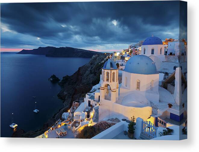Greece Canvas Print featuring the photograph View Of Oia Village On Santorini Island In Greece. #9 by Cavan Images