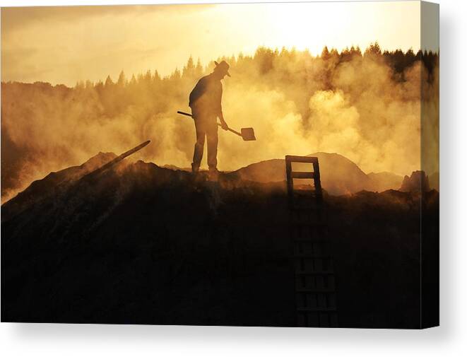 A Canvas Print featuring the photograph A Charcoal Burner by Attila Szabo