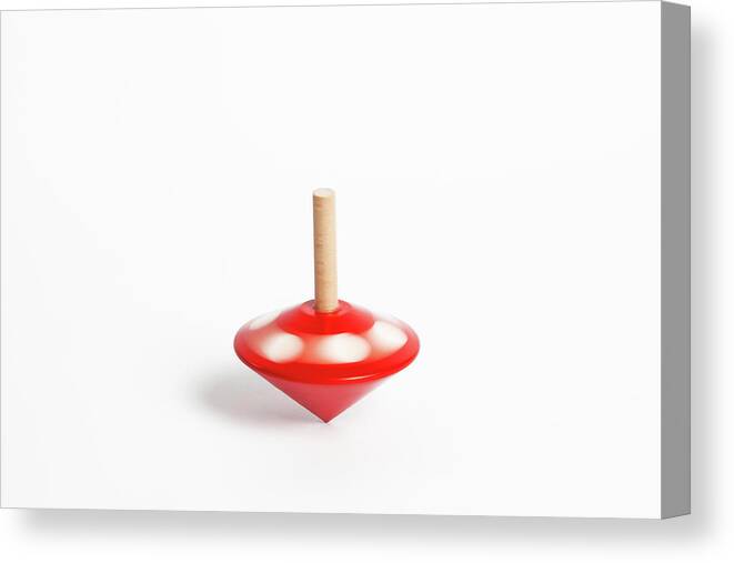 White Background Canvas Print featuring the photograph A Childs Spinning Wooden Top by Diane Macdonald
