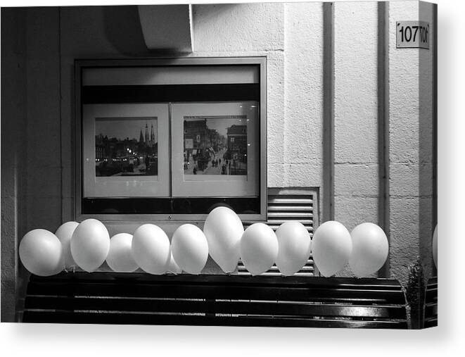 Urban Scenes Canvas Print featuring the photograph A Dozen White Balloons at 107 by Mary Lee Dereske