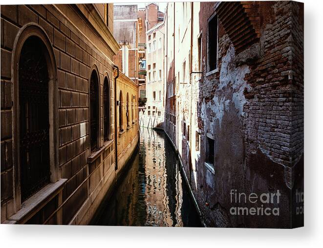 Adriatic Canvas Print featuring the photograph A shadow in the venetian noon narrow canal by Marina Usmanskaya