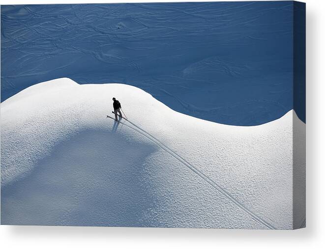 Skiing Canvas Print featuring the photograph A Skier In The Alps by Henrik Trygg, Johner