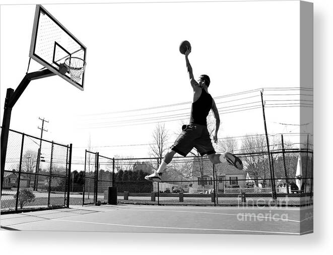 Play Canvas Print featuring the photograph A Young Basketball Player Flying by Arena Creative