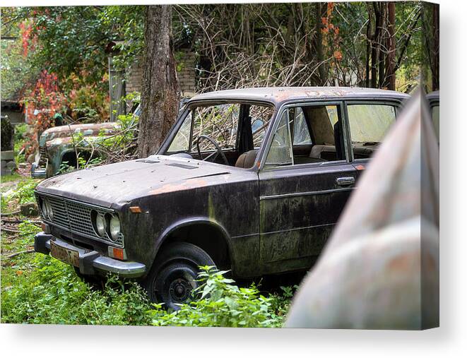 Urban Canvas Print featuring the photograph Abandoned Car in the Garden by Roman Robroek
