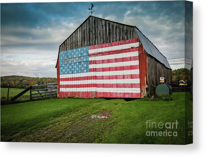 Grass Canvas Print featuring the photograph American Flag On A Barn by D. Eugene Lee