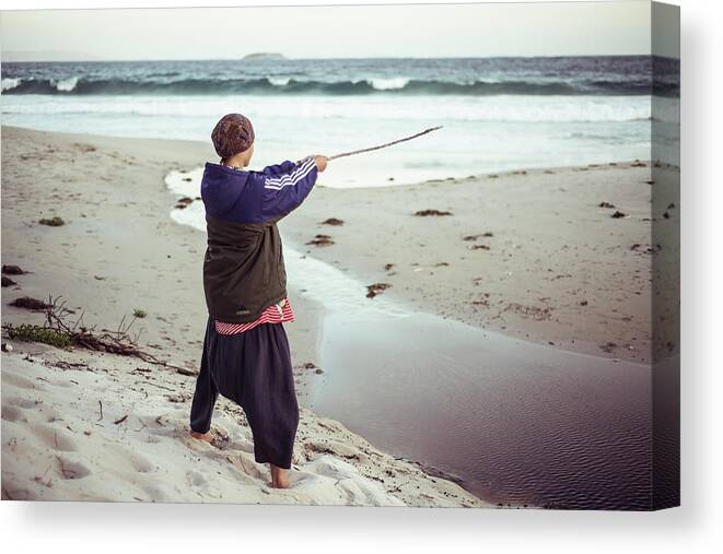 Androgynous Figure In Sport Jacket On Beach Points Ninja Stick At Sea  Canvas Print / Canvas Art by Cavan Images - Fine Art America