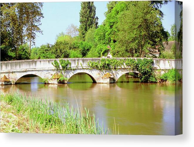 Arch Canvas Print featuring the photograph Arch Bridge Over A River, Montresor by Medioimages/photodisc