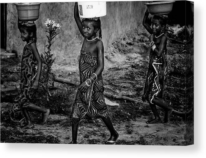 Water Canvas Print featuring the photograph Back Home With The Water - Benin by Joxe Inazio Kuesta Garmendia