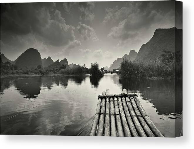 Yangshuo Canvas Print featuring the photograph Bamboo Raft On Li River by Ipandastudio