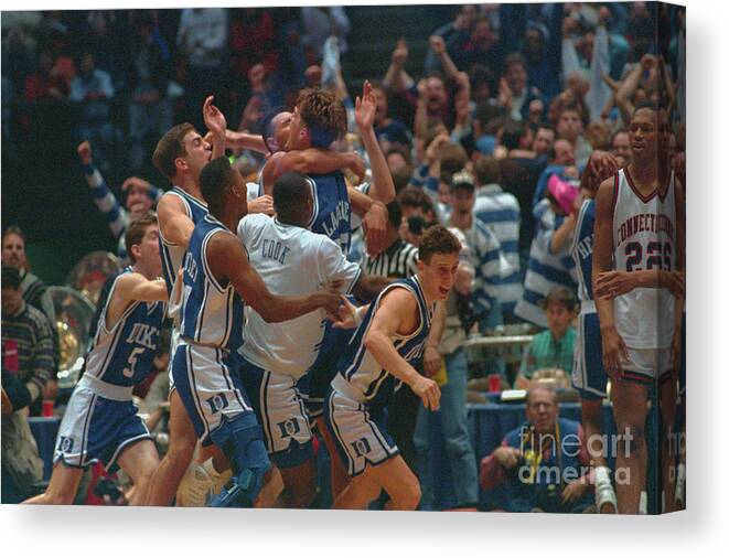 University Of Connecticut Canvas Print featuring the photograph Basketball Action With Christian by Bettmann