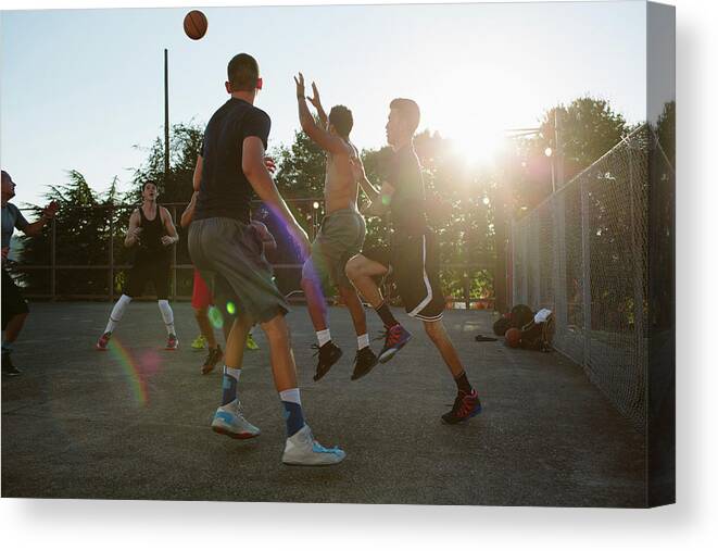 Basketball Players Canvas Print featuring the photograph Basketball Players Playing In Court by Cavan Images