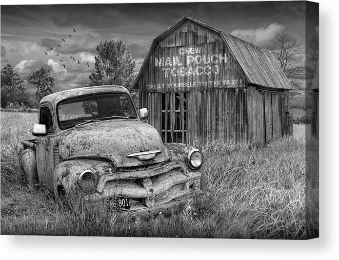Chevy Canvas Print featuring the photograph Black and White of Rusted Chevy Pickup Truck in a Rural Landscape by a Mail Pouch Tobacco Barn by Randall Nyhof
