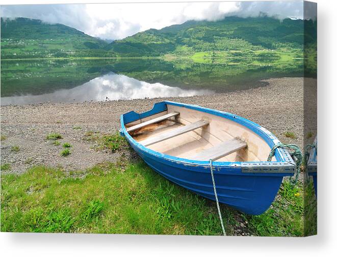 Water's Edge Canvas Print featuring the photograph Boat On The Shore With Calm Lake And by R9 ronaldo