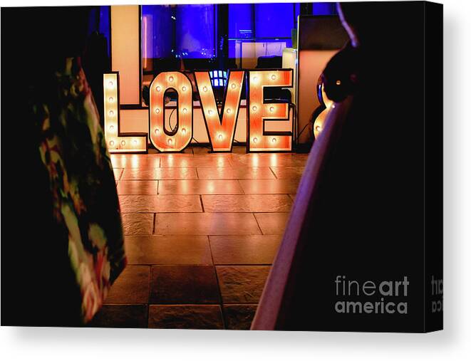 Bright Canvas Print featuring the photograph Bright wooden letters with word Love in a party by Joaquin Corbalan