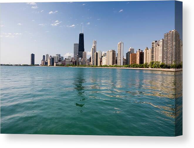 Lake Michigan Canvas Print featuring the photograph Chicago Skyline From The Lake by Stevegeer