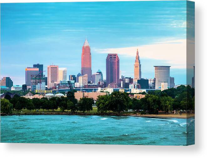 Water's Edge Canvas Print featuring the photograph Cleveland And The Lake Erie Shore At by Drnadig