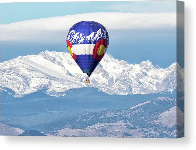 Balloon Canvas Print featuring the photograph Colorado Hot Air Balloon Mimics the Mountains by Tony Hake