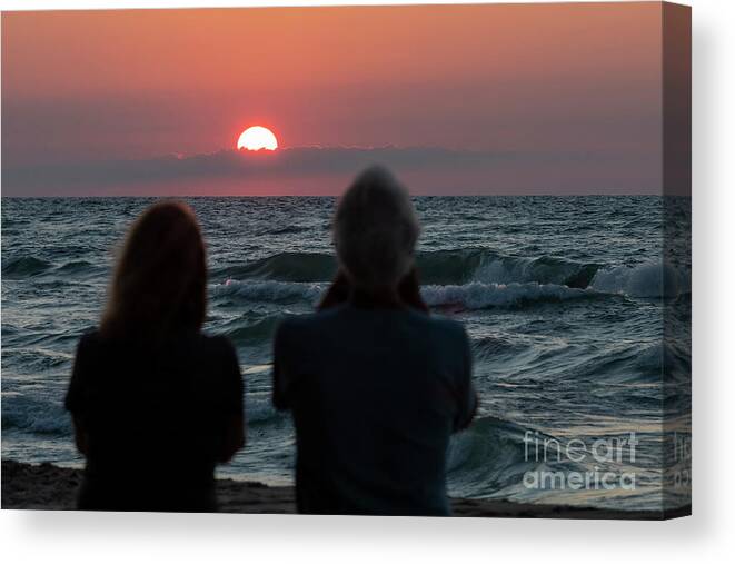 Lake Michigan Canvas Print featuring the photograph Couple Watching The Sunset Over Lake Michigan by Jim West/science Photo Library