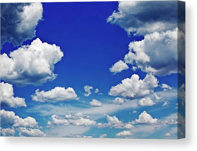 Scenics Canvas Print featuring the photograph Cumulus Clouds And Blue Sky by John W Banagan