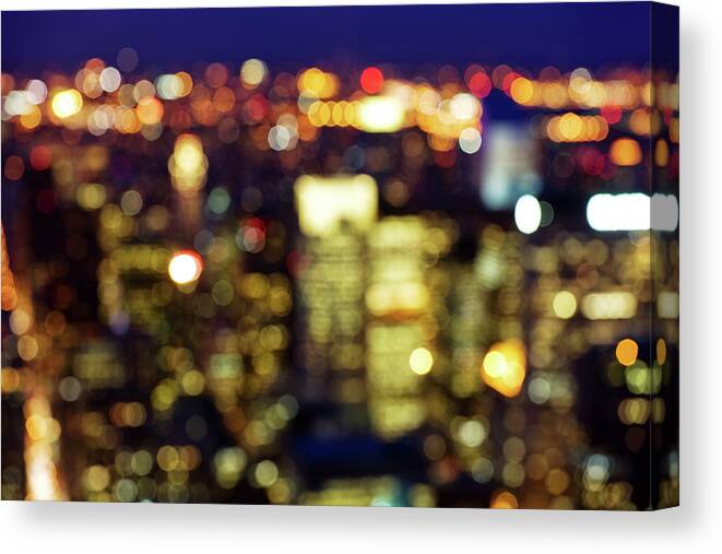 Downtown District Canvas Print featuring the photograph Defocussed City Lights by Nikada