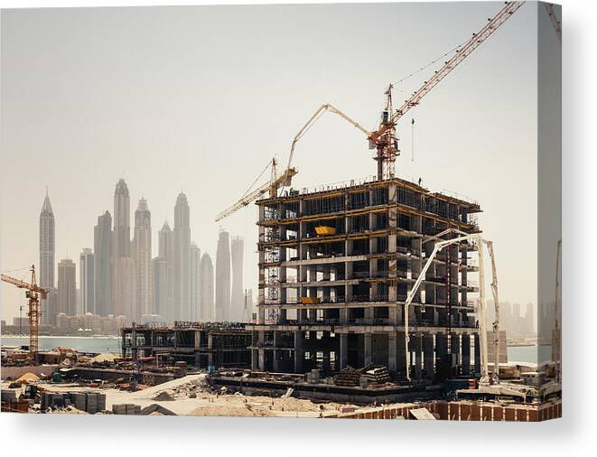 Working Canvas Print featuring the photograph Dubai Construction by Borchee
