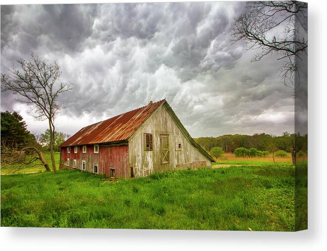 East Moriches Red Barn Storm Clouds Spring Green Grass Farm Field Stormy Rural Long Island New York Canvas Print featuring the photograph East Moriches Red Barn Storm by Robert Seifert