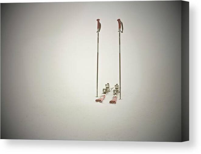 Ski Pole Canvas Print featuring the photograph Empty Skis And Poles In Snow by Ross Woodhall