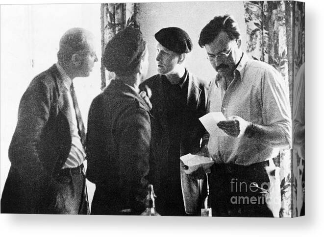 Ernest Hemingway Canvas Print featuring the photograph Ernest Hemingway And Others In Spain by Bettmann