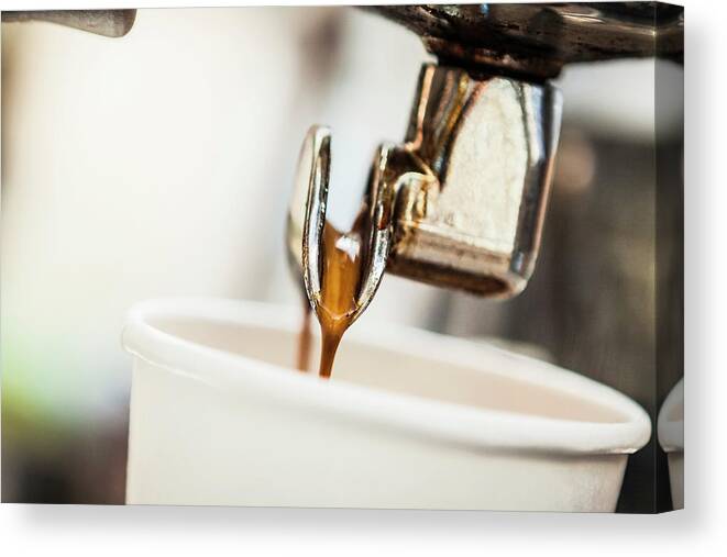 Coffee Maker Canvas Print featuring the photograph Espresso Pouring From Machine Into Cup by Manuel Sulzer