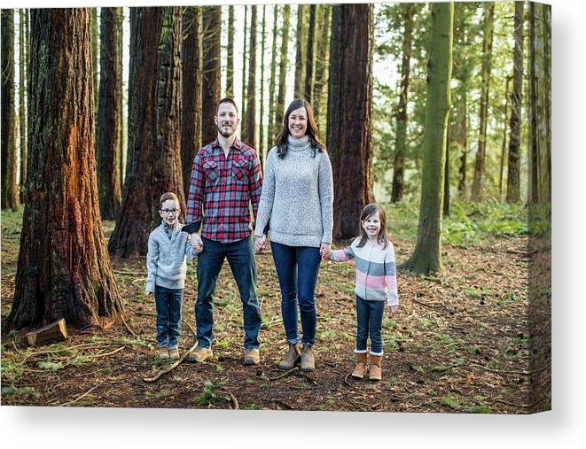 Togetherness Canvas Print featuring the photograph Family Holding Hands, Standing In Forest. by Cavan Images