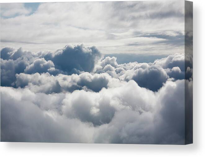 Scenics Canvas Print featuring the photograph Fluffy White Clouds From Above by Carterdayne