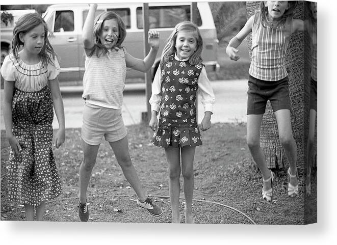 Jumping Canvas Print featuring the photograph Four Girls, Jumping, 1972 by Jeremy Butler