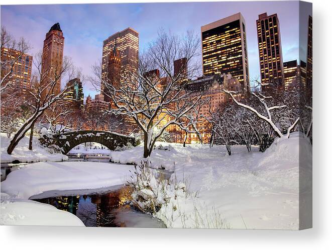 Snow Canvas Print featuring the photograph Gapstow Bridge And The New York City by Denistangneyjr