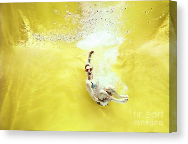 Underwater Canvas Print featuring the photograph Girl Jumping Into Water On Yellow by Stanislaw Pytel