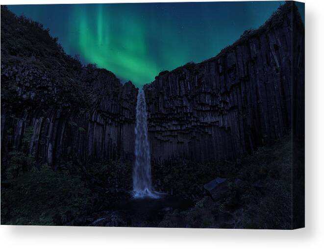 Northern Lights Canvas Print featuring the photograph Green Svartifoss by Jose Parejo