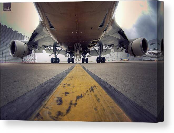 Outdoors Canvas Print featuring the photograph Ground Level Shot Of Plane by Happykiddo Photography