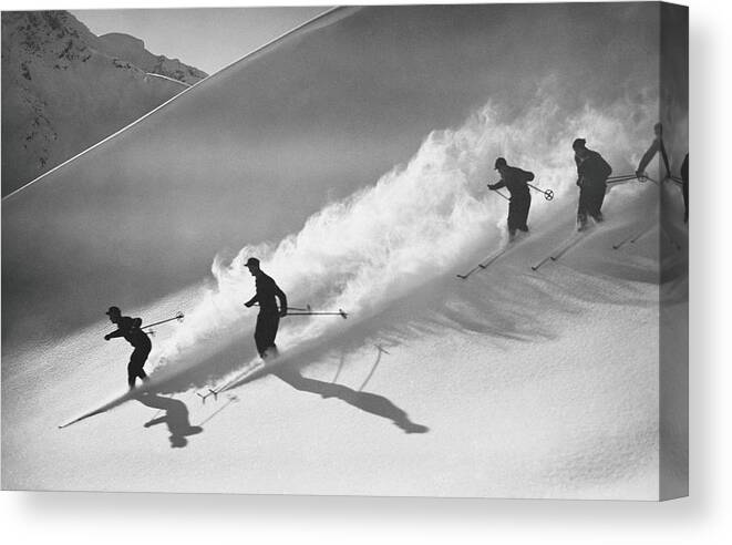 Skiing Canvas Print featuring the photograph Group Of Skiers Descending Alpine by H. Armstrong Roberts