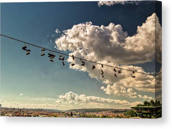 Buildings Canvas Print featuring the photograph hanging shoes on Prague by Vivida Photo PC