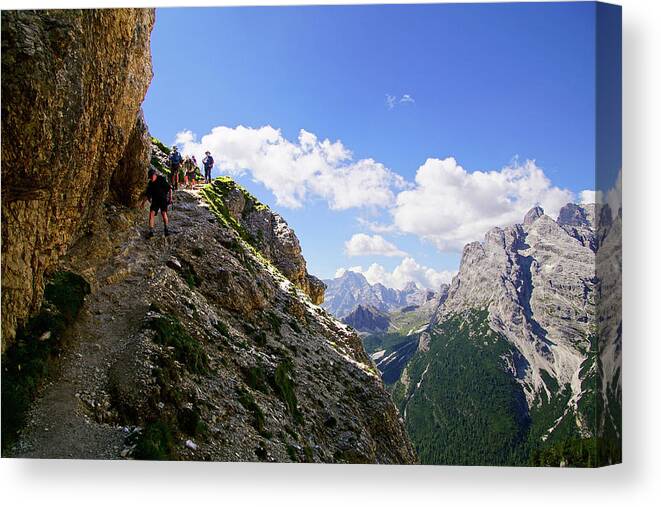 Dolomites Canvas Print featuring the photograph Hikers on steep trail up Monte piana by Steve Estvanik