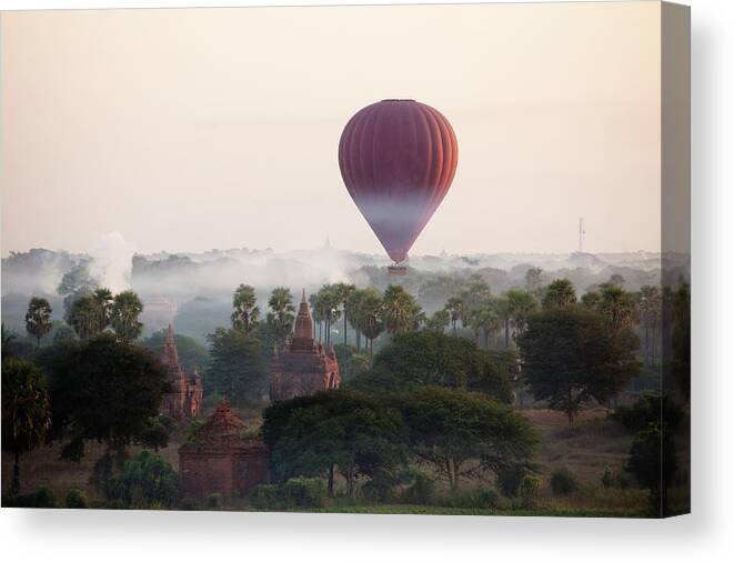 Pagoda Canvas Print featuring the photograph Hot-air Balloon Rising In Bagan by Wu Swee Ong