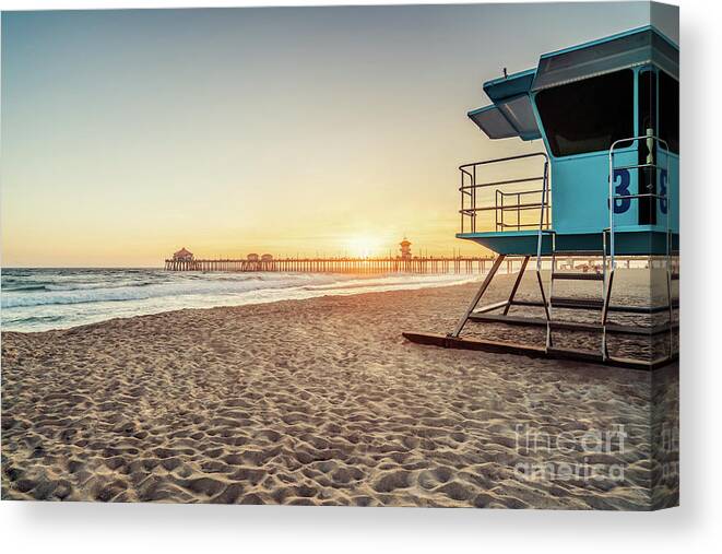 America Canvas Print featuring the photograph Huntington Beach Lifeguard Tower 3 and Pier Sunset Photo by Paul Velgos