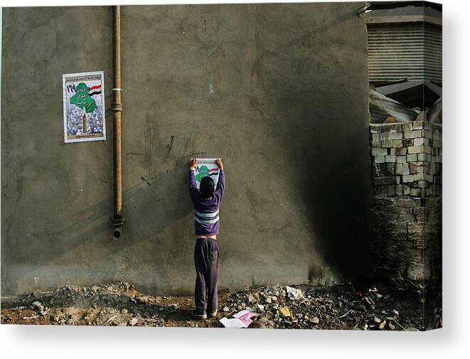 Democracy Canvas Print featuring the photograph Iraqi Shias Hang Political Posters by Chris Hondros