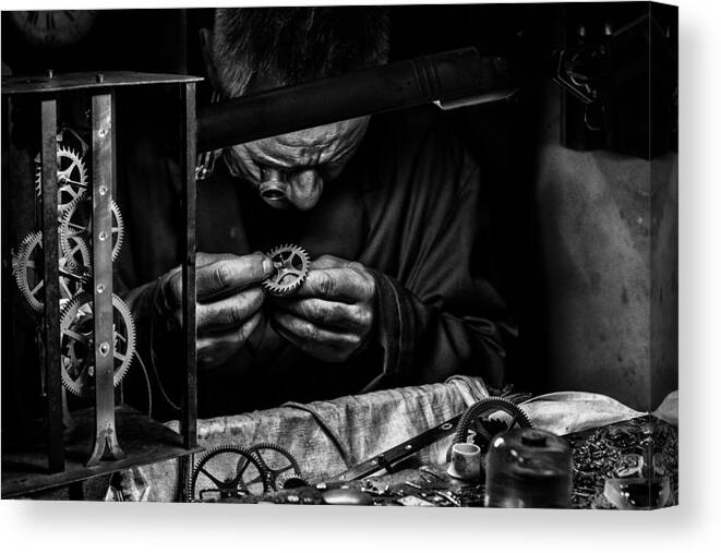 Hands Canvas Print featuring the photograph L'horloger (watchmaker) by Manu Allicot